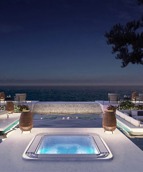 Astralpool Verona overflow spa with nighttime hotel view