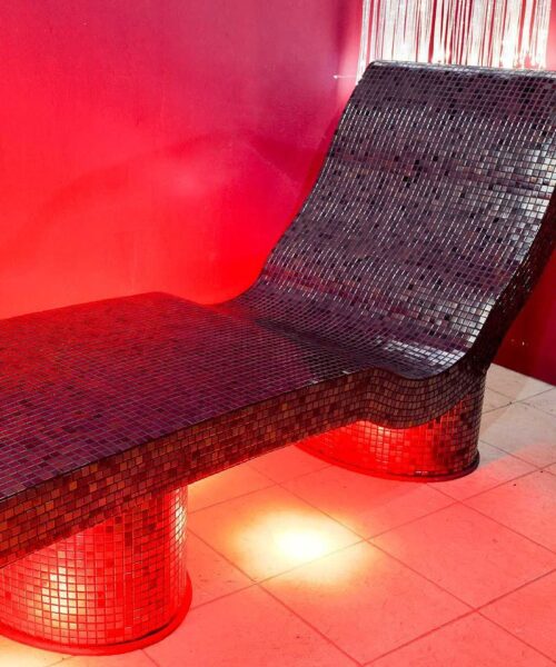 Tiled spa lounger in steam room