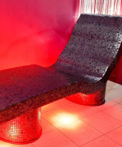 Tiled spa lounger in steam room