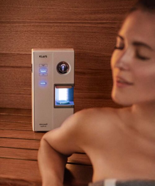 Woman using the Klafs MicroSalt SaltProX in sauna