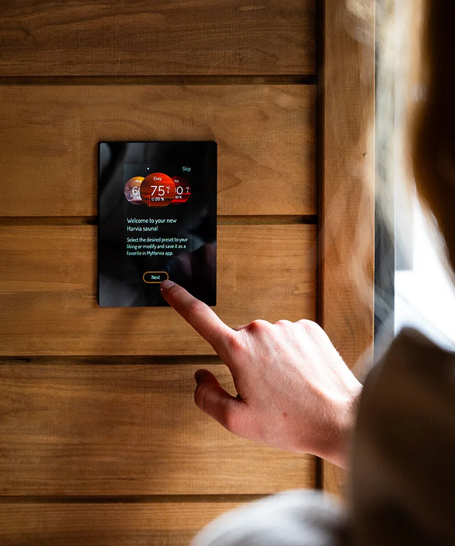 Harvia Fenix Control Panel Being Operated by Woman