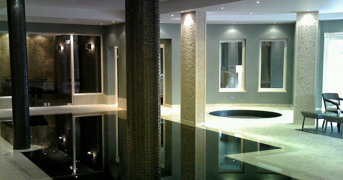 Bespoke Sauna Installed with Matching Tiled Steam Room and Infinity Pool