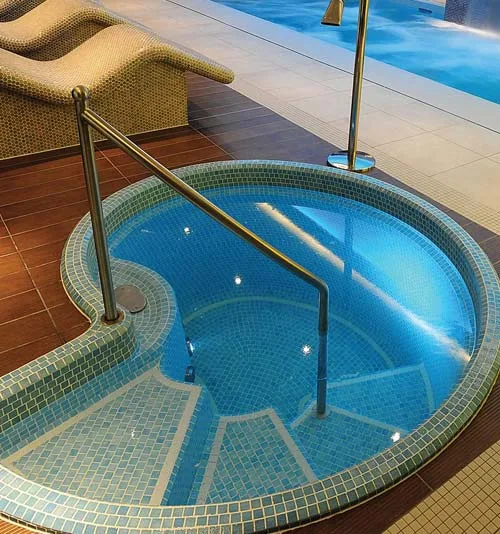 Bespoke shell shaped tiled spa