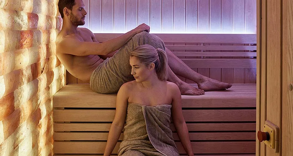 Himalayan salt sauna with backlit wall